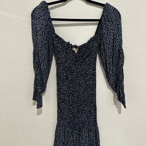Sun becomes her black and blue floral dress. Size 4. Stretchy